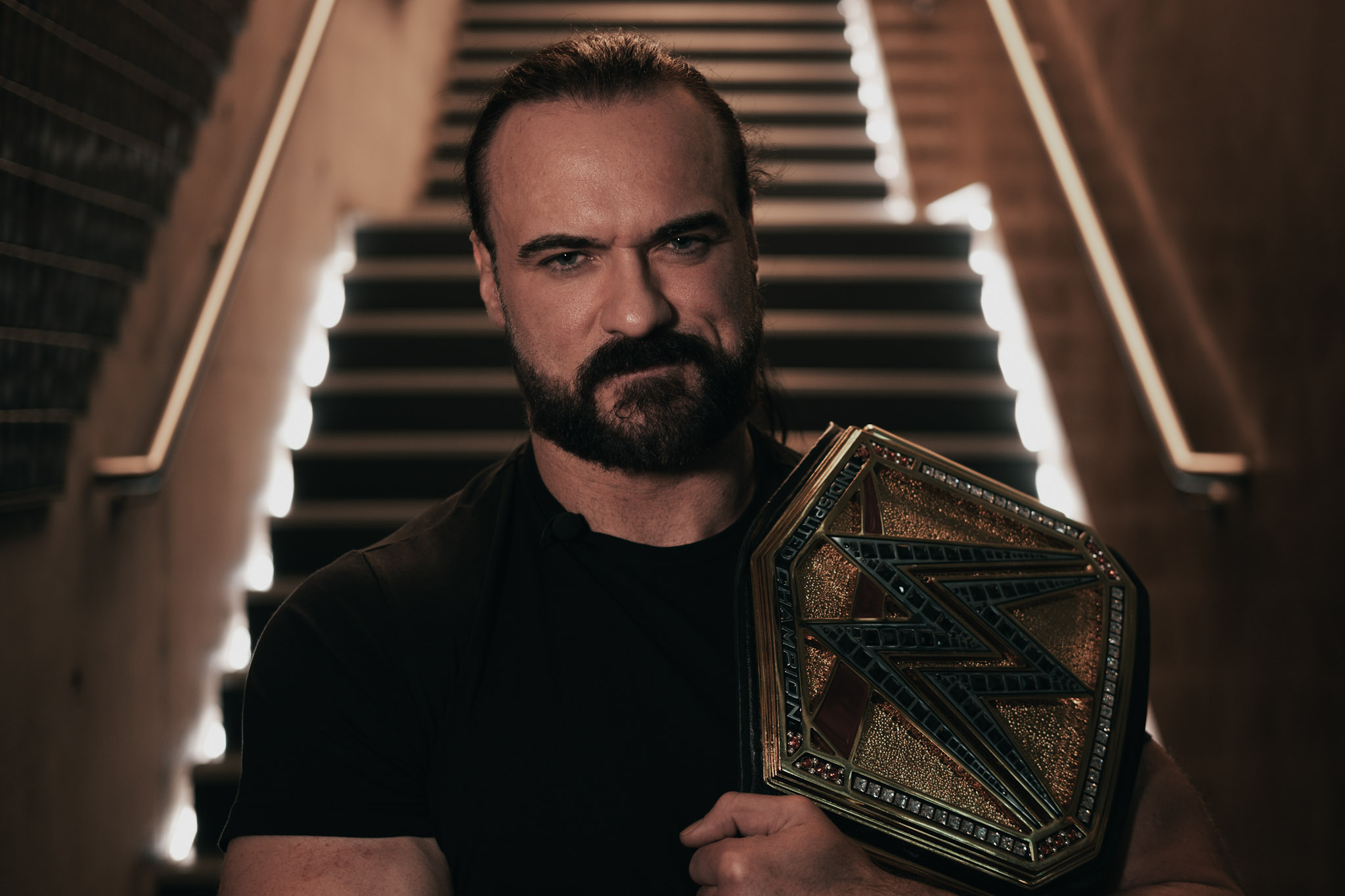 Wrestler Drew McIntyre celebrates after winning the title of Undisputed WWE Champion